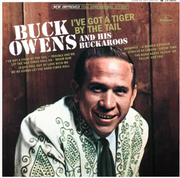 Buck Owens - I've Got A Tiger By The Tail (Orange Vinyl) by Autumn Records