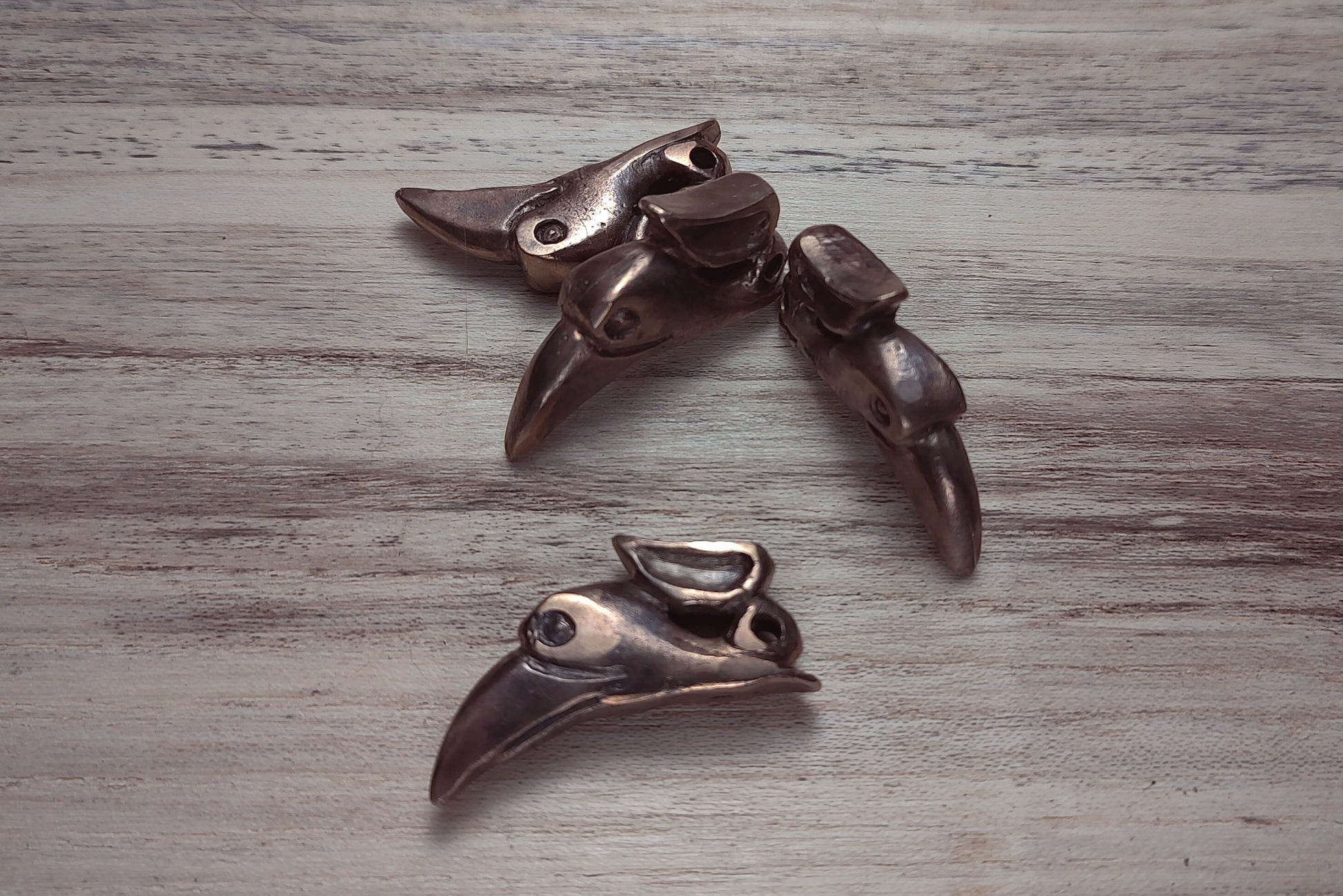 Bronze cast raven pendants by B.W. Williams Cutlery