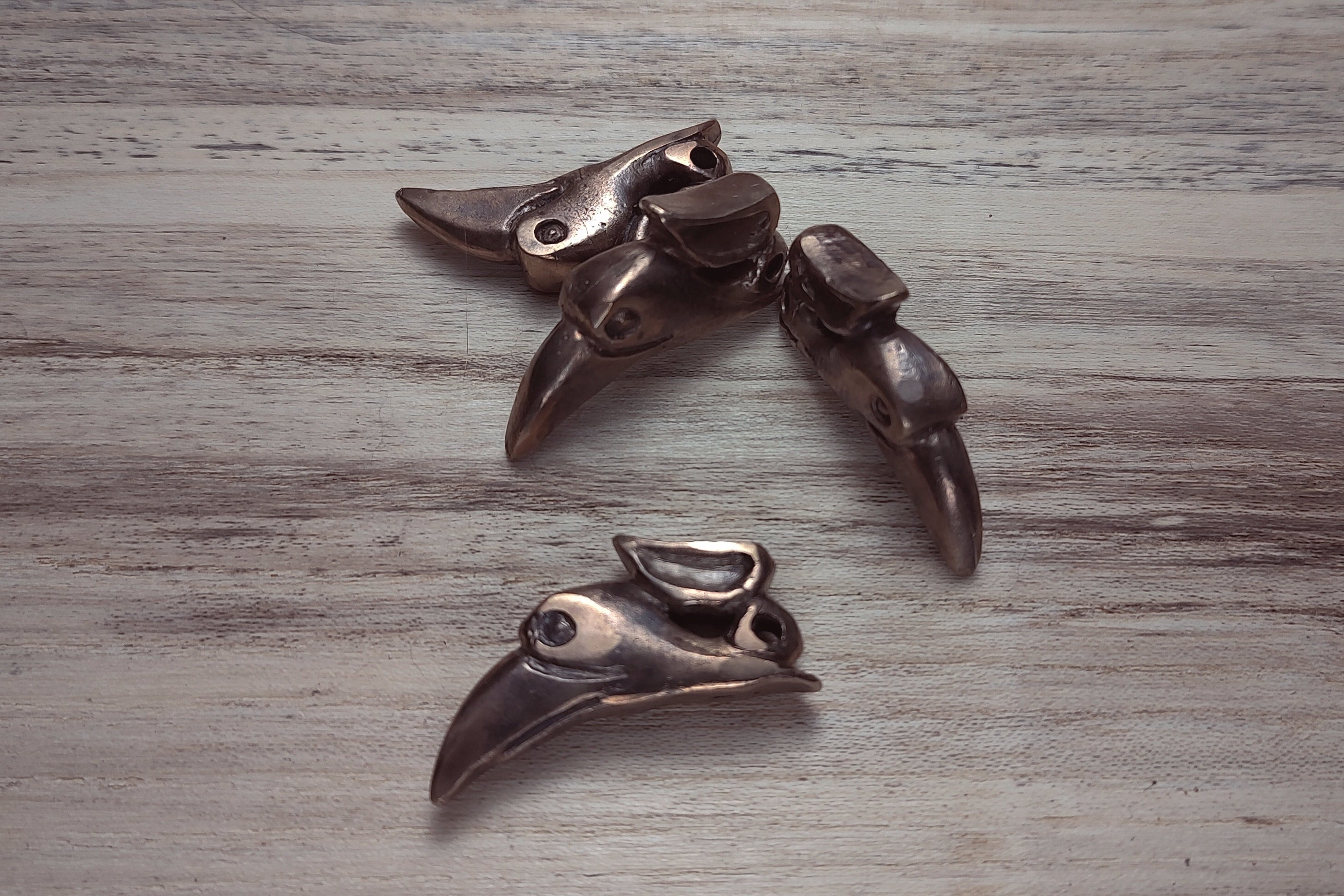 Bronze cast raven pendants by B.W. Williams Cutlery