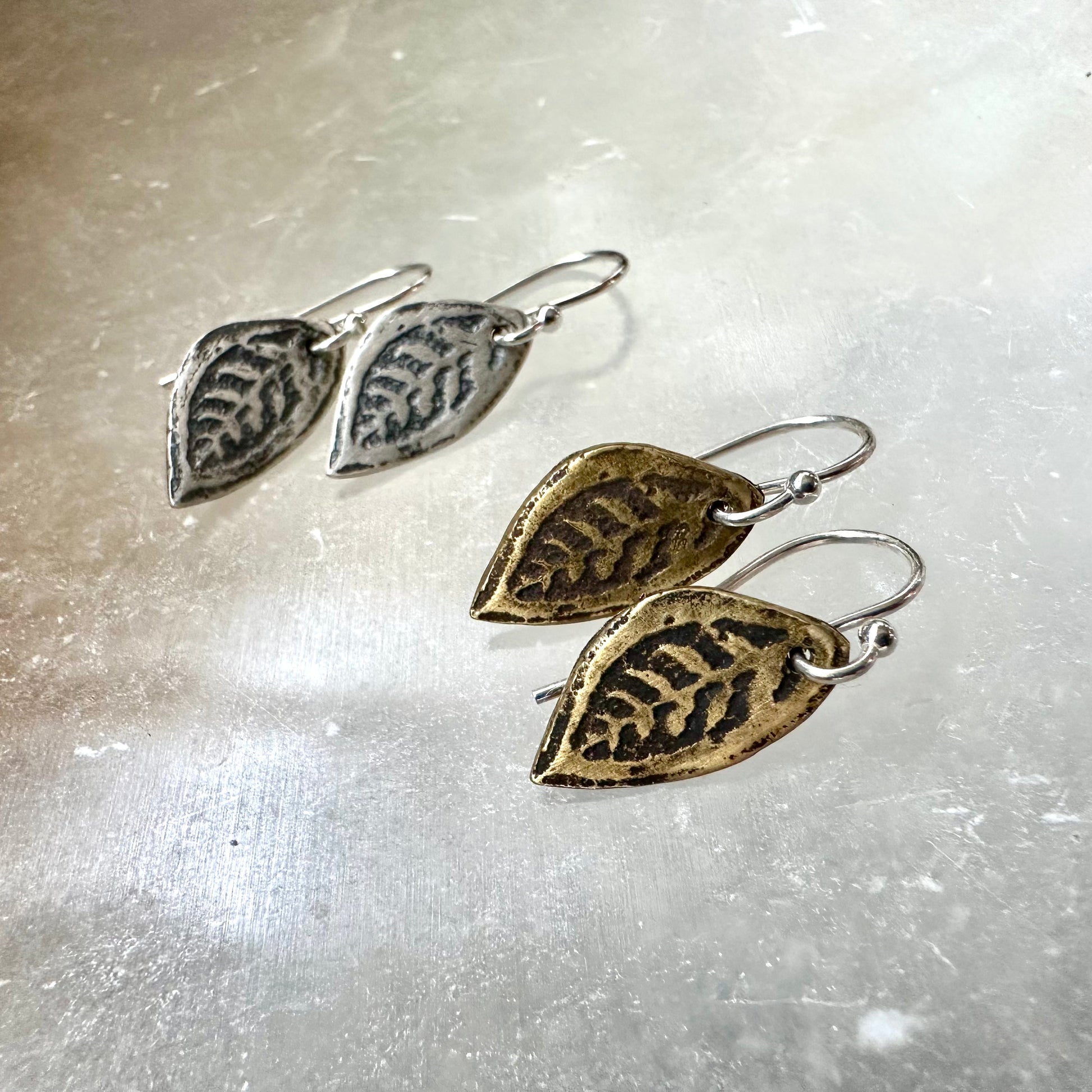 Tiny Leaf Earrings by jenkahnjewelry