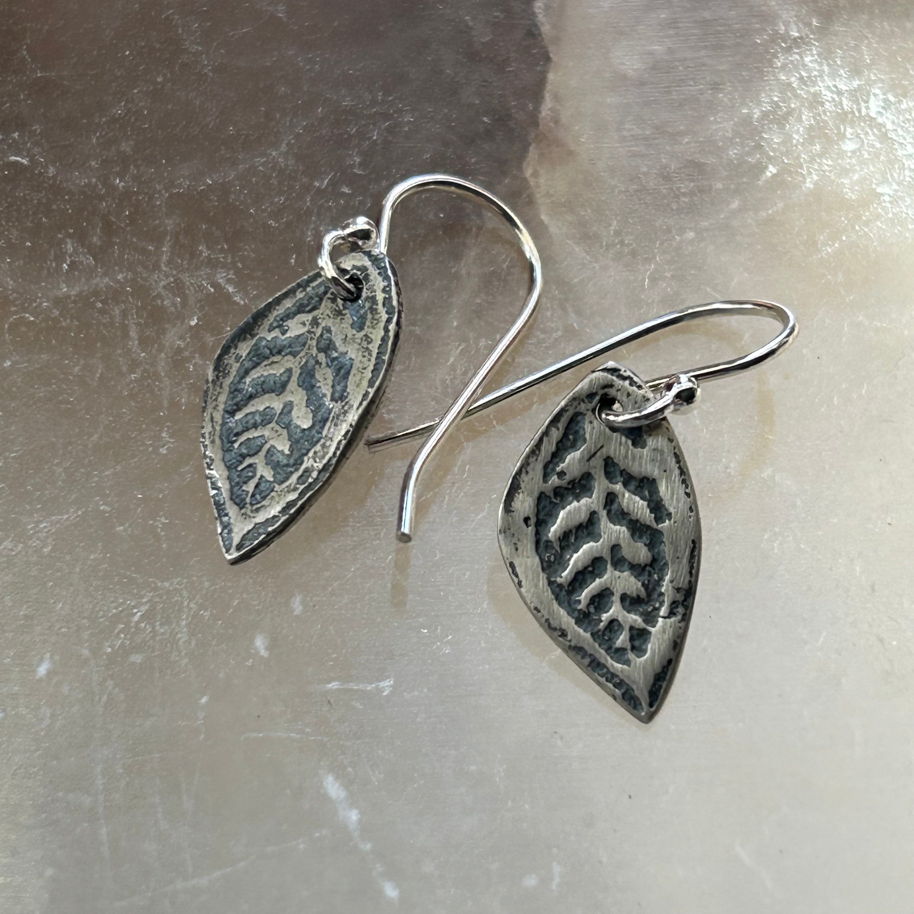Tiny Leaf Earrings by jenkahnjewelry