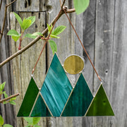 Root Studio Mountains and Sun Stained Glass