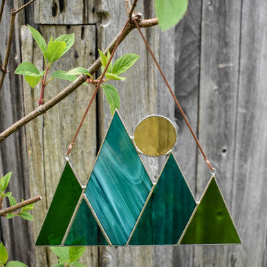 Root Studio Mountains and Sun Stained Glass