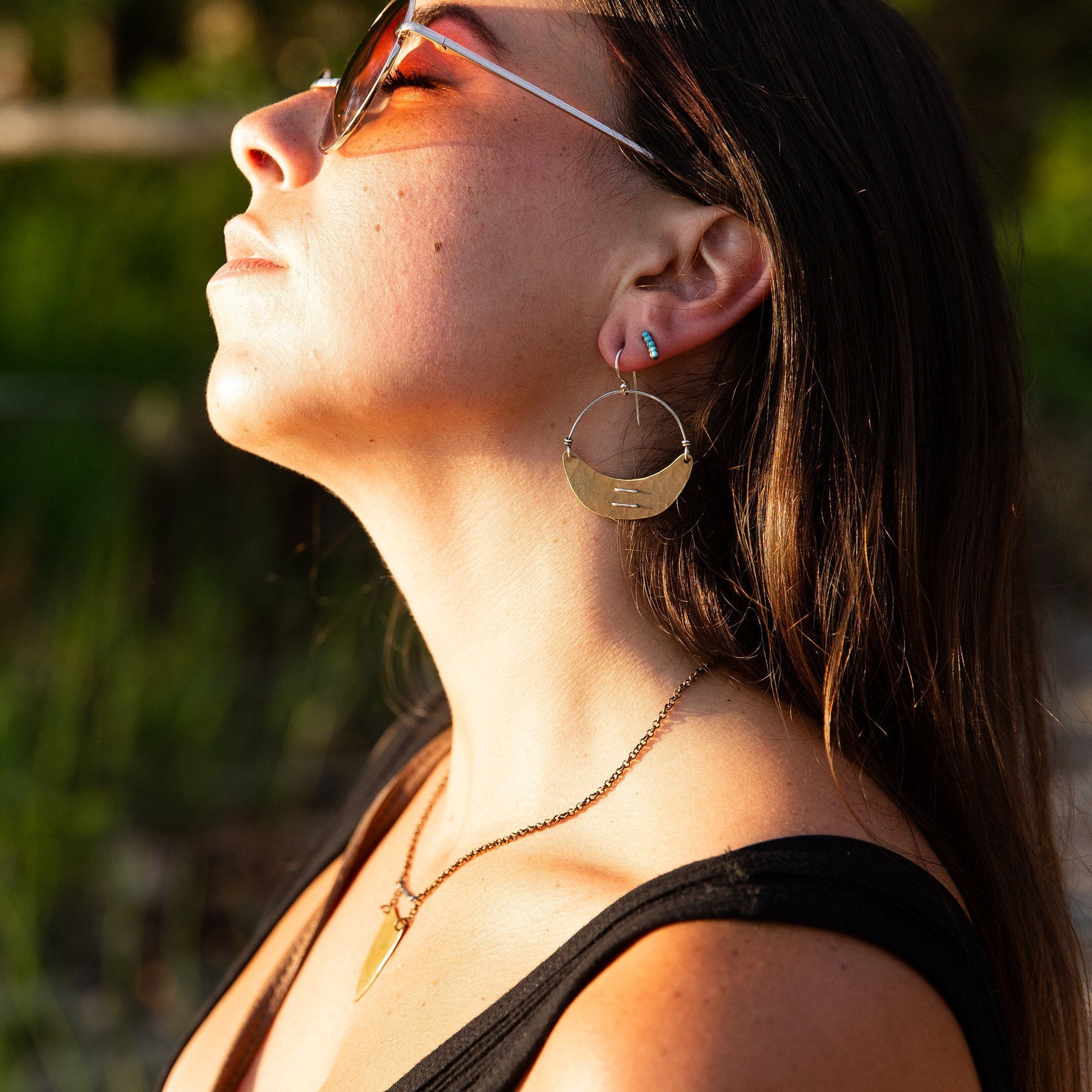 Stitched Brass Crescent Earrings by jenkahnjewelry