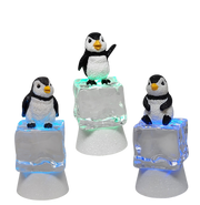 Penguin Sitting on Color-changing Lighted Icecube -